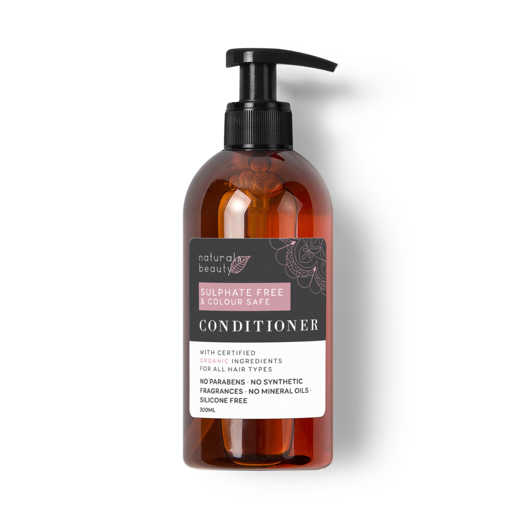 Brown conditioner glass bottle with pump on a white background