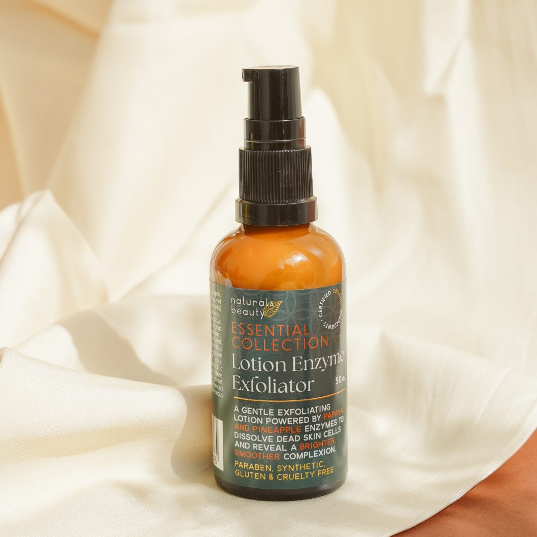 Glass Bottle of lotion enzyme exfoliator from Naturals Beauty, with a beige background clean, organic skincare. 