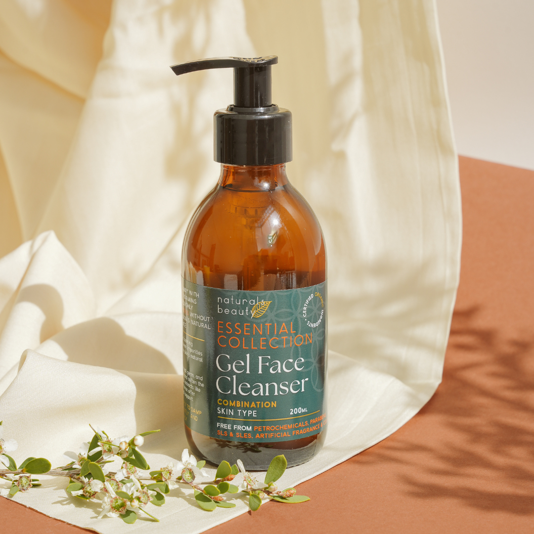 Brown bottle of Naturals Beauty Gel Face Cleanser with a green label on a neutral background