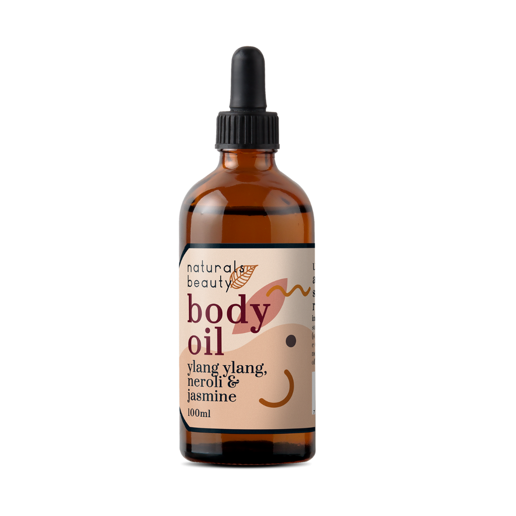 Bottle of natural body oil with a dropper on a white background