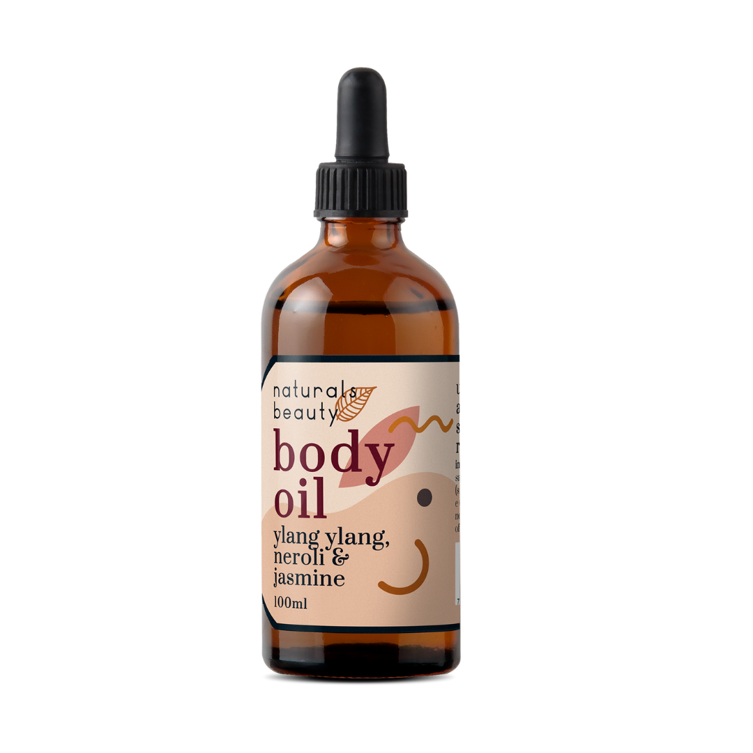 Bottle of natural body oil with a dropper on a white background